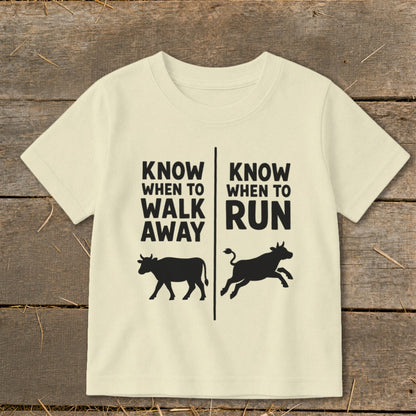 Cream t-shirt with "Know When To Walk Away" and "Know When To Run" text and cow graphics.