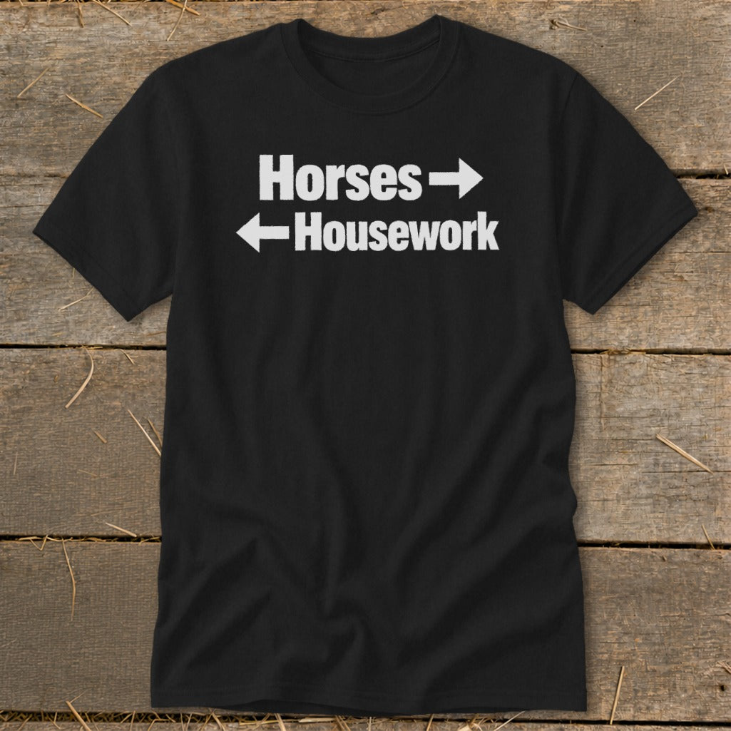 A black t-shirt printed with the white text "Horses" pointing right and "Housework" pointing left.