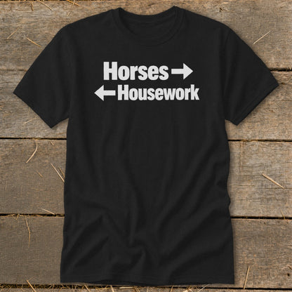 A black t-shirt printed with the white text "Horses" pointing right and "Housework" pointing left.
