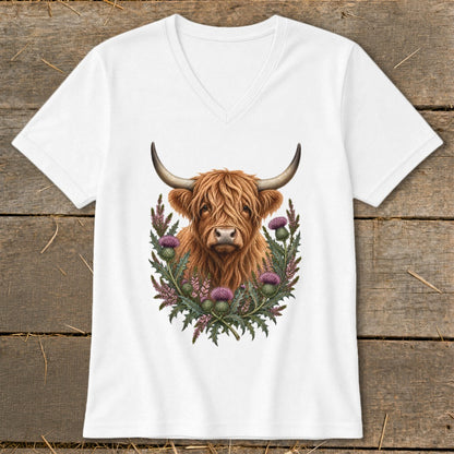 White v-neck t-shirt with a Highland cow and thistles graphic.