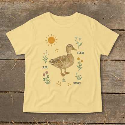 Pale yellow t-shirt with a duckling, sun, and wildflowers print.