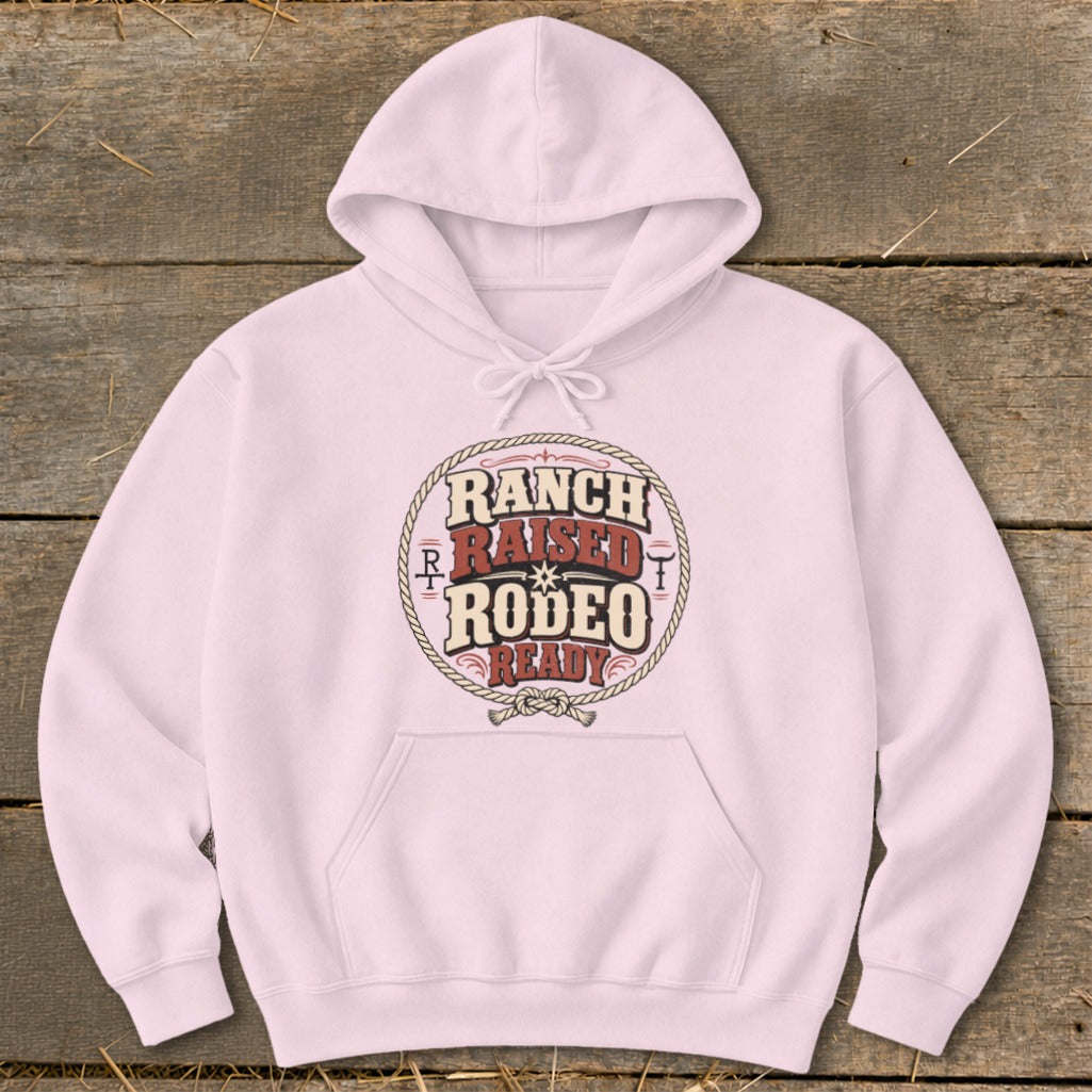 Pink hoodie with "Ranch Raised Rodeo Ready" text design on a rope circle.