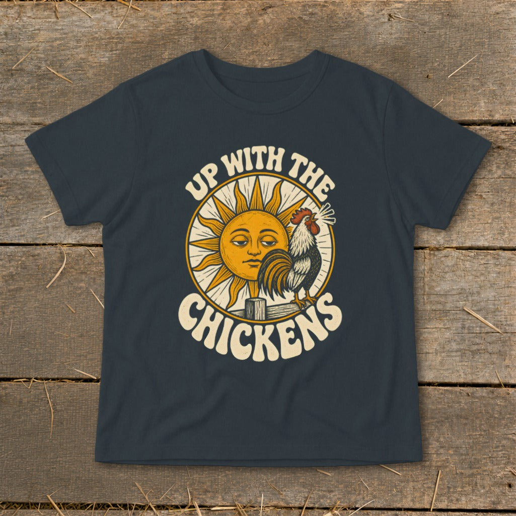 A dark gray t-shirt with a vintage graphic of a rooster, a smiling sun, and the text Up With The Chickens.