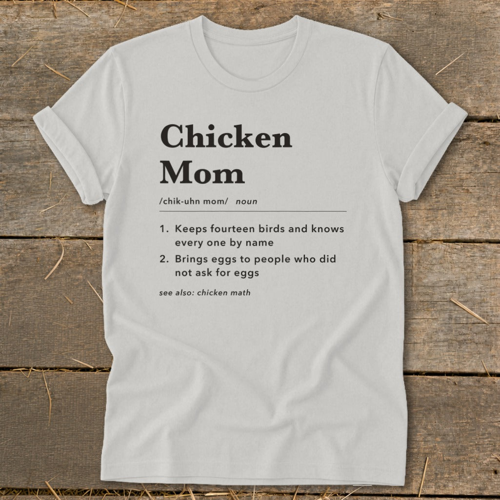 White t-shirt with "Chicken Mom" definition and related humorous phrases.