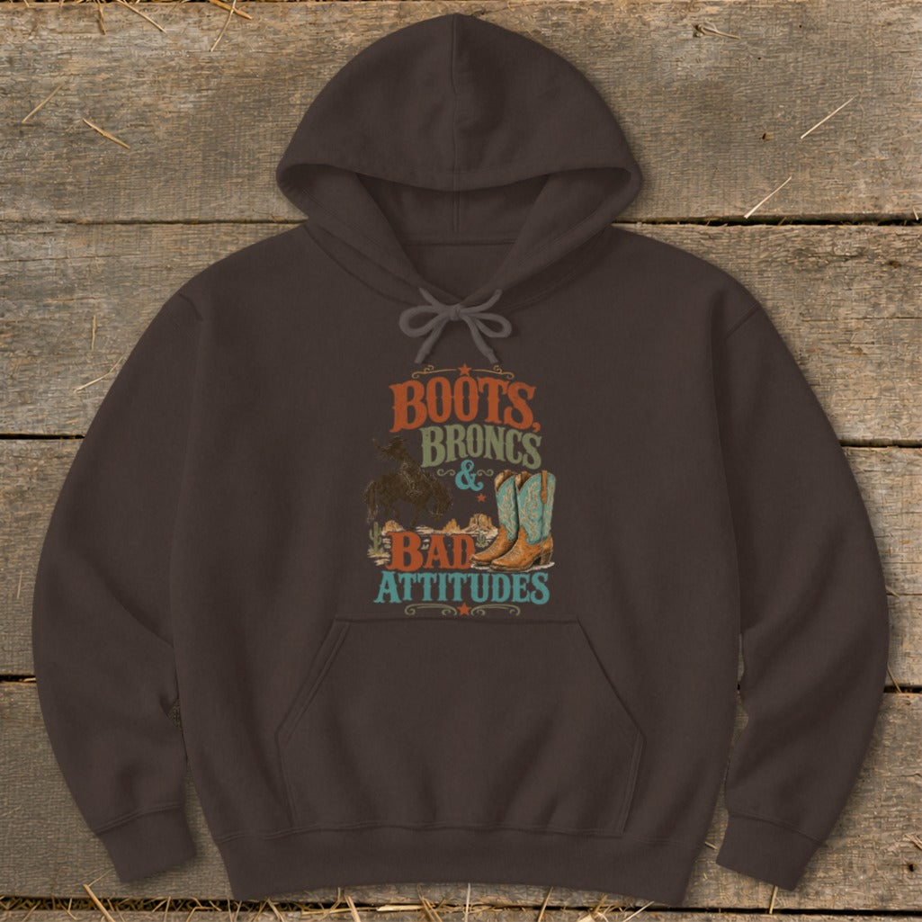 Brown hoodie with "Boots, Broncs & Bad Attitudes" graphic featuring cowboy boots.
