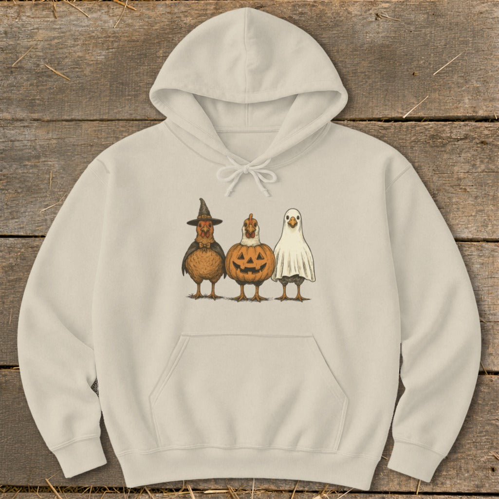 Beige hoodie with Halloween chickens dressed as a witch, pumpkin, and ghost.