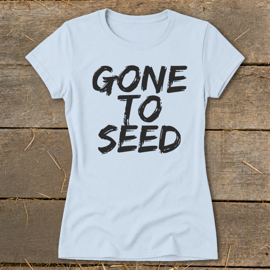 Light blue t-shirt with black text that reads "GONE TO SEED".