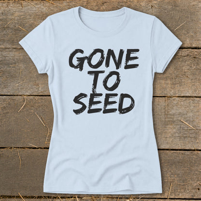 Light blue t-shirt with black text that reads "GONE TO SEED".