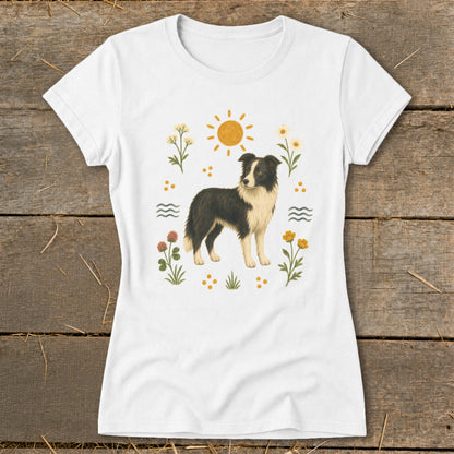 White t-shirt with a Border Collie dog surrounded by sun, flowers, and waves.
