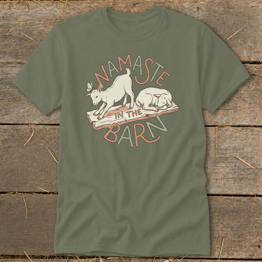 Two goats and text "Namaste In The Barn" graphic on an olive green t-shirt.