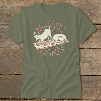 Two goats and text "Namaste In The Barn" graphic on an olive green t-shirt.
