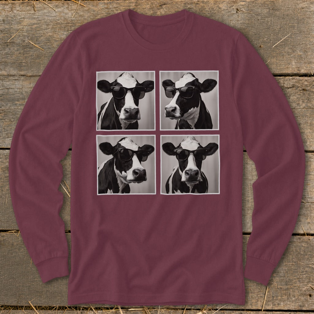 Four black and white portraits of cows wearing sunglasses on a maroon long-sleeve shirt.