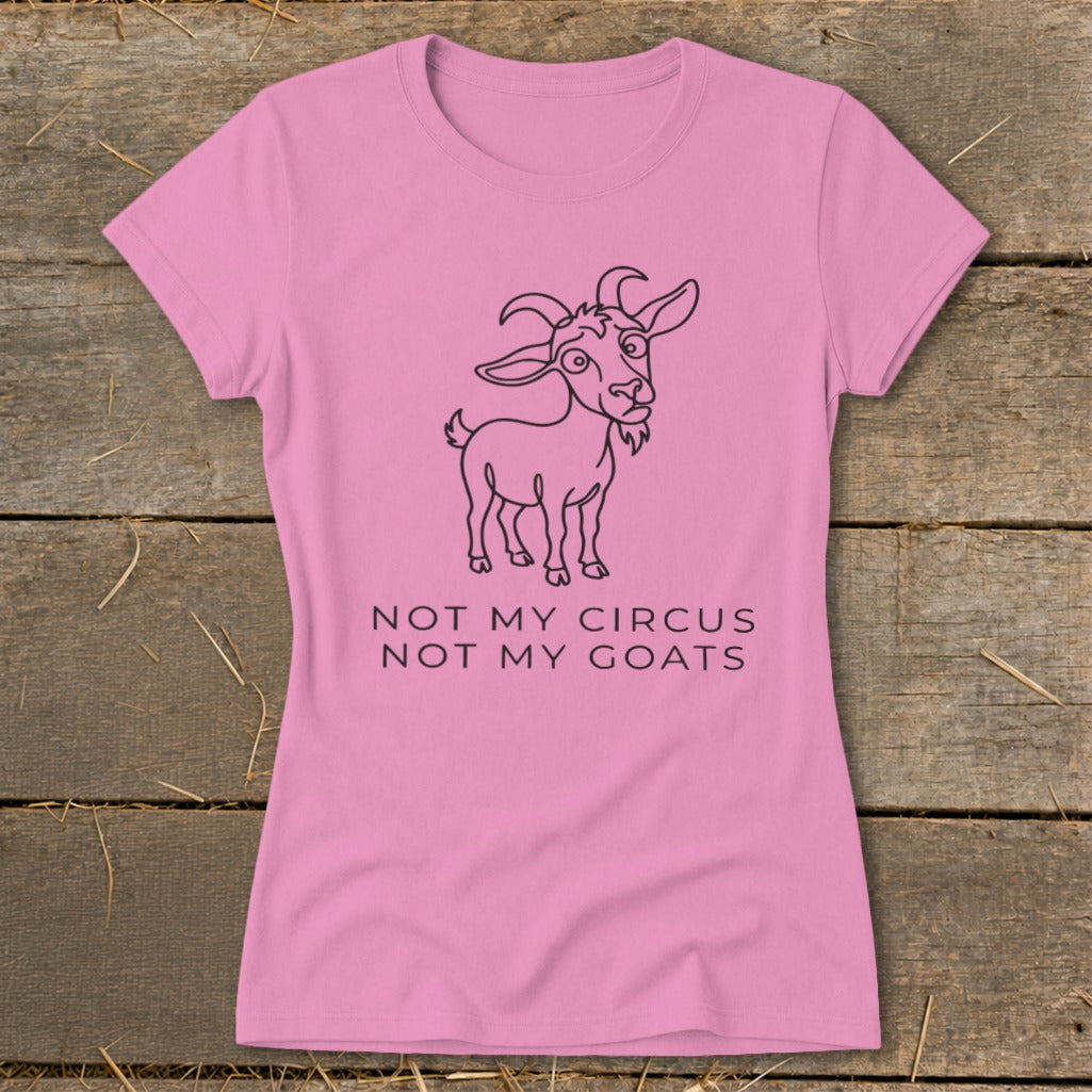 Pink t-shirt with line drawing of a goat and text "NOT MY CIRCUS NOT MY GOATS".