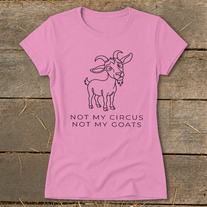 Pink t-shirt with line drawing of a goat and text "NOT MY CIRCUS NOT MY GOATS".