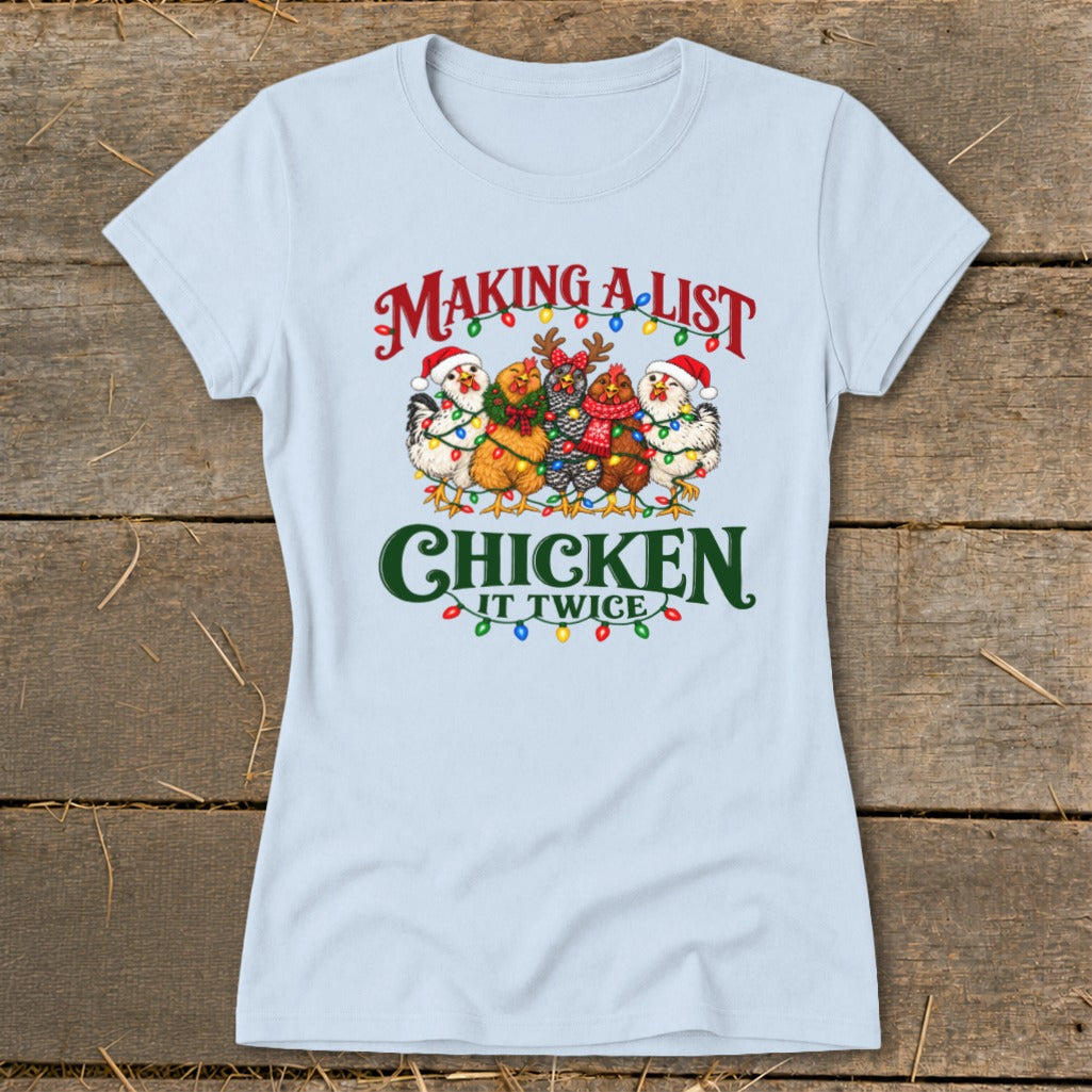 Light blue t-shirt with "Making a list, chicken it twice" text and festive chickens.