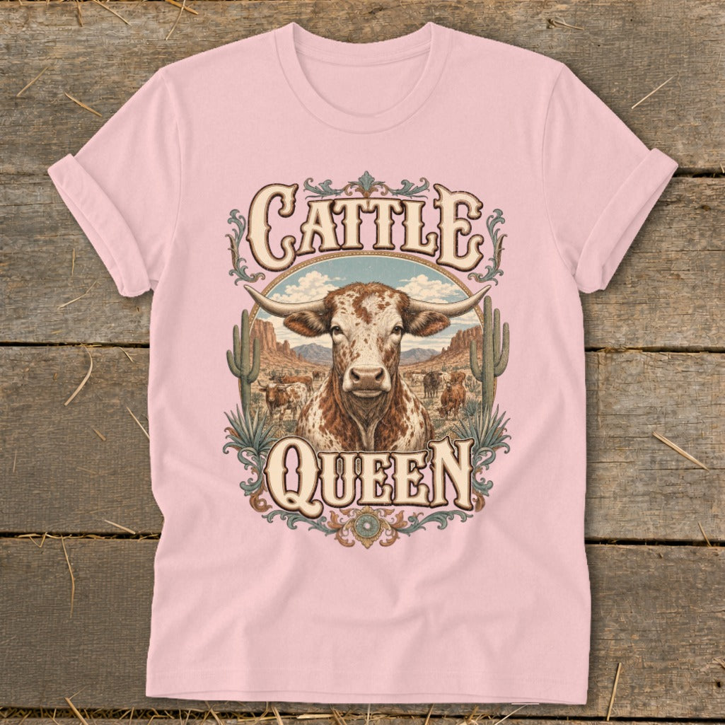 Longhorn cow and landscape with text "Cattle Queen" on pink t-shirt.