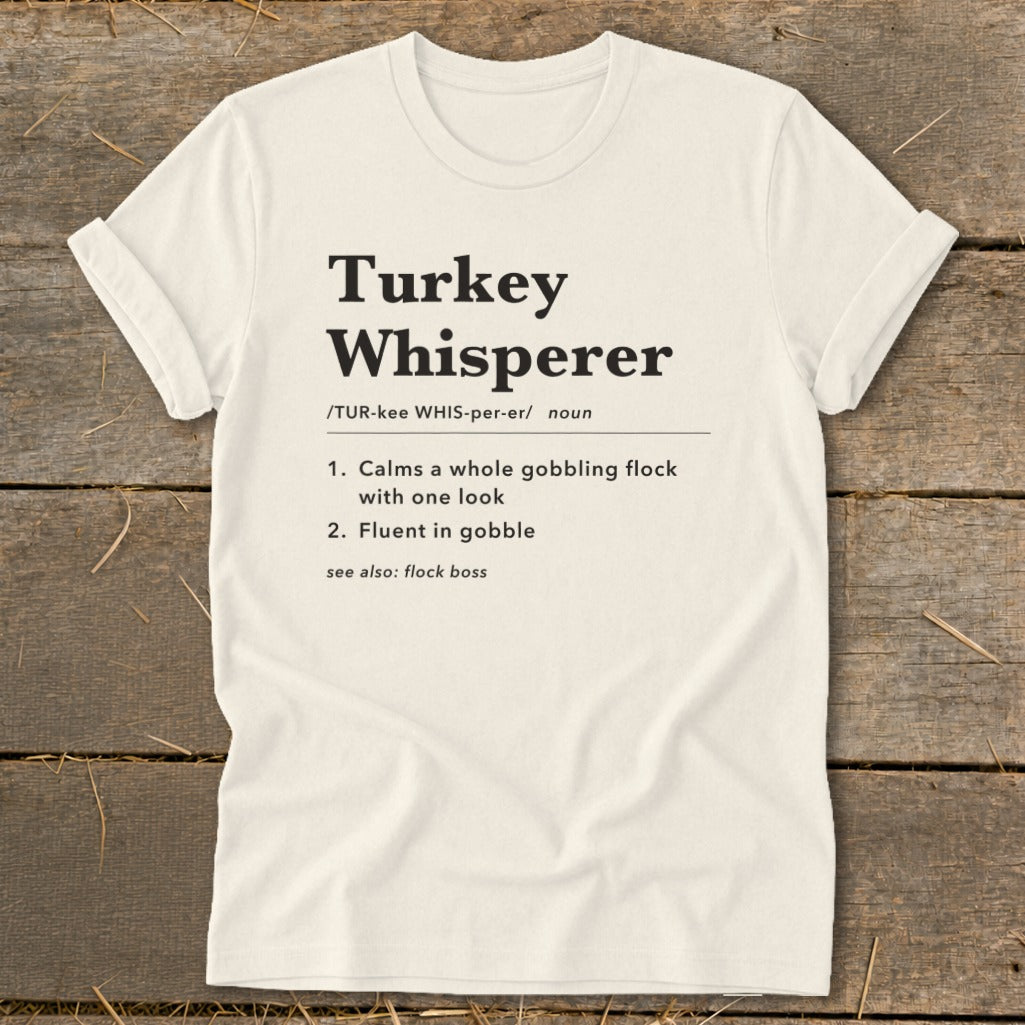 Cream t-shirt with "Turkey Whisperer" definition and humorous descriptions.