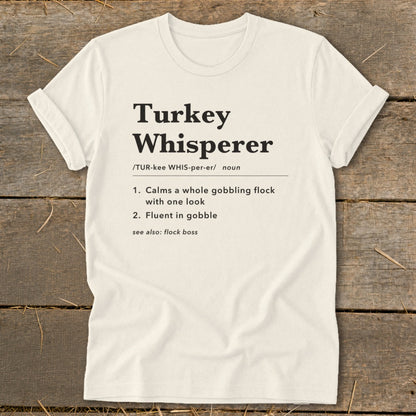 Cream t-shirt with "Turkey Whisperer" definition and humorous descriptions.