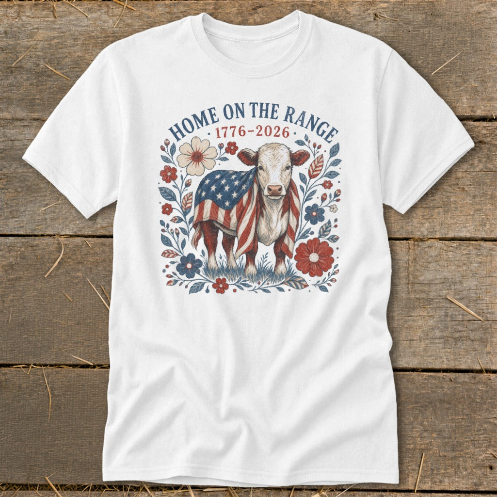 White t-shirt with a cow wrapped in an American flag and "Home on the Range 1776-2026" text.