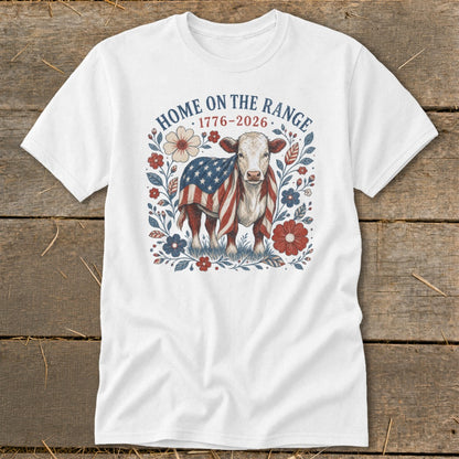 White t-shirt with a cow wrapped in an American flag and "Home on the Range 1776-2026" text.