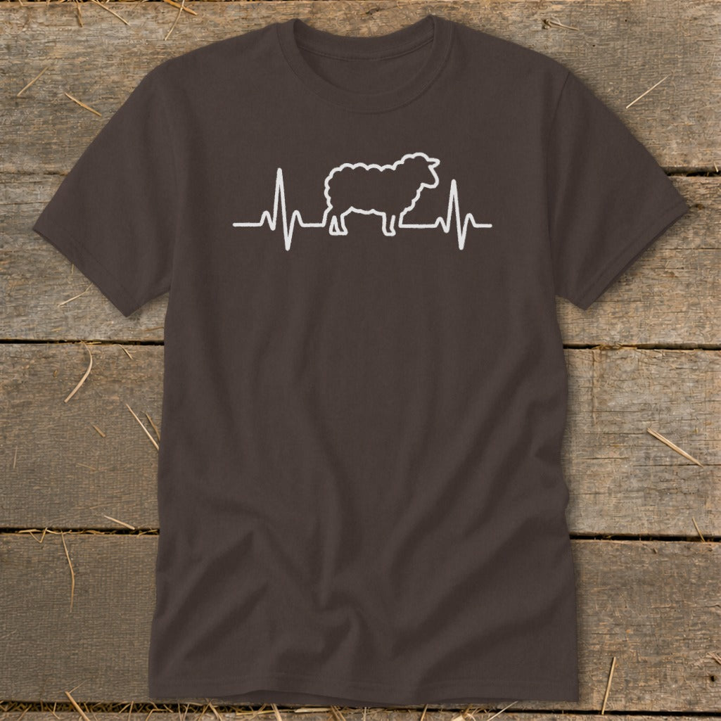 A dark brown short-sleeved t-shirt featuring a white graphic of a sheep integrated into a heartbeat line.
