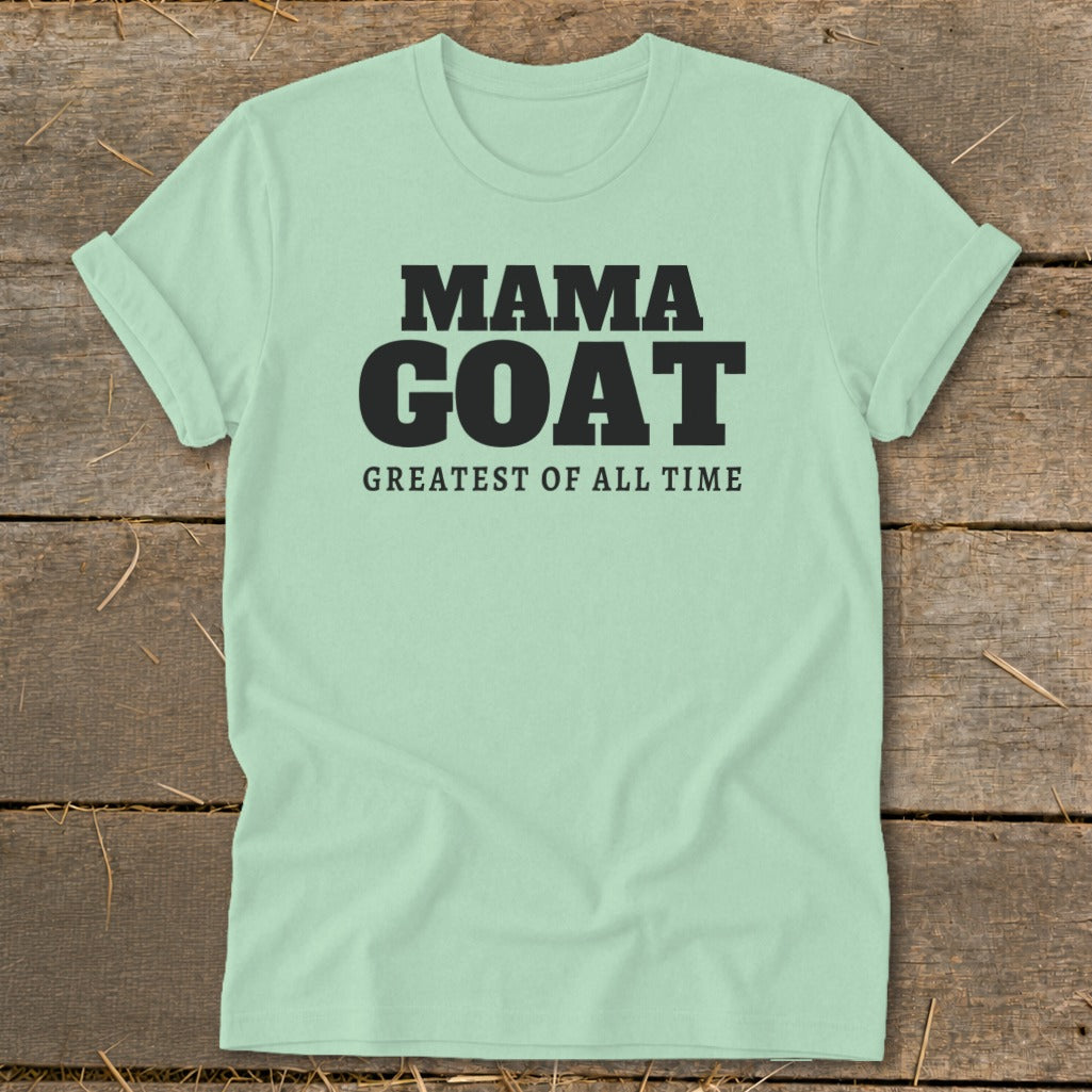 Light green t-shirt with black text reading "MAMA GOAT GREATEST OF ALL TIME".