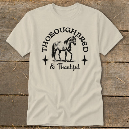 Thoroughbred & Thankful text with a drawing of a horse on a cream t-shirt.
