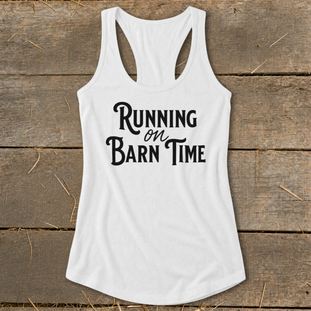 White racerback tank top with black text "Running on Barn Time."