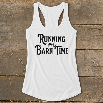 White racerback tank top with black text "Running on Barn Time."