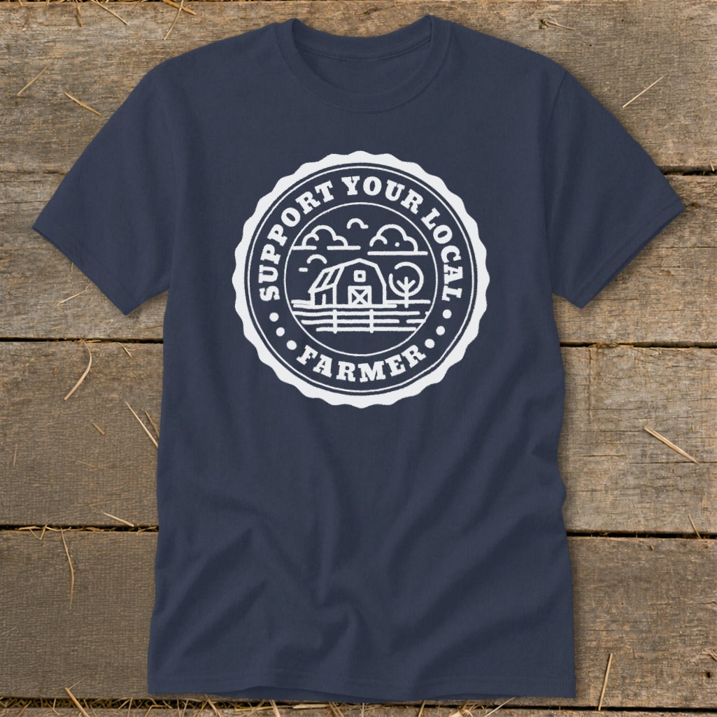 Navy t-shirt with white circular graphic "Support Your Local Farmer" and barn scene.