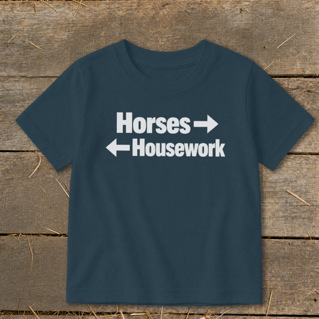 Dark blue crewneck t-shirt with white text reading Horses and Housework with directional arrows.
