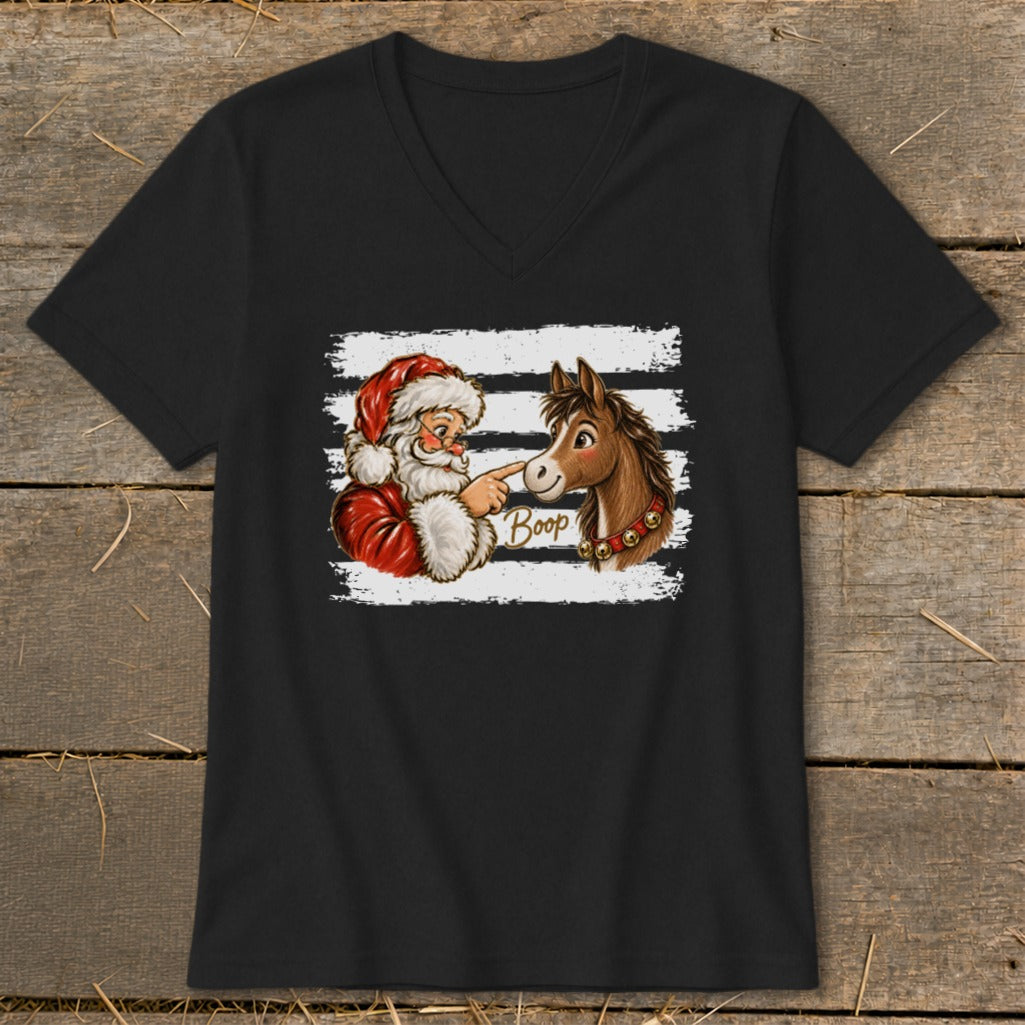 Santa Claus touching a horse's nose with the word "Boop" written on the shirt.