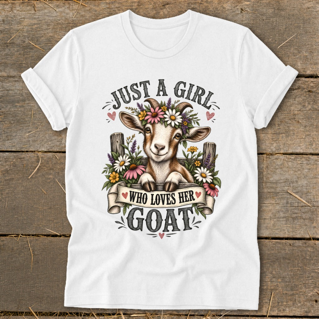 White t-shirt with a smiling goat wearing flowers and text that says "Just a girl who loves her goat."
