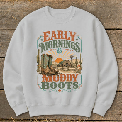 White sweatshirt with "Early Mornings & Muddy Boots" text and western graphic.