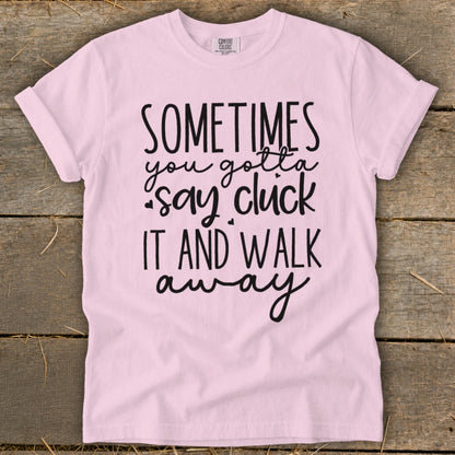 Light pink t-shirt with black text that says "Sometimes you gotta say cluck it and walk away".