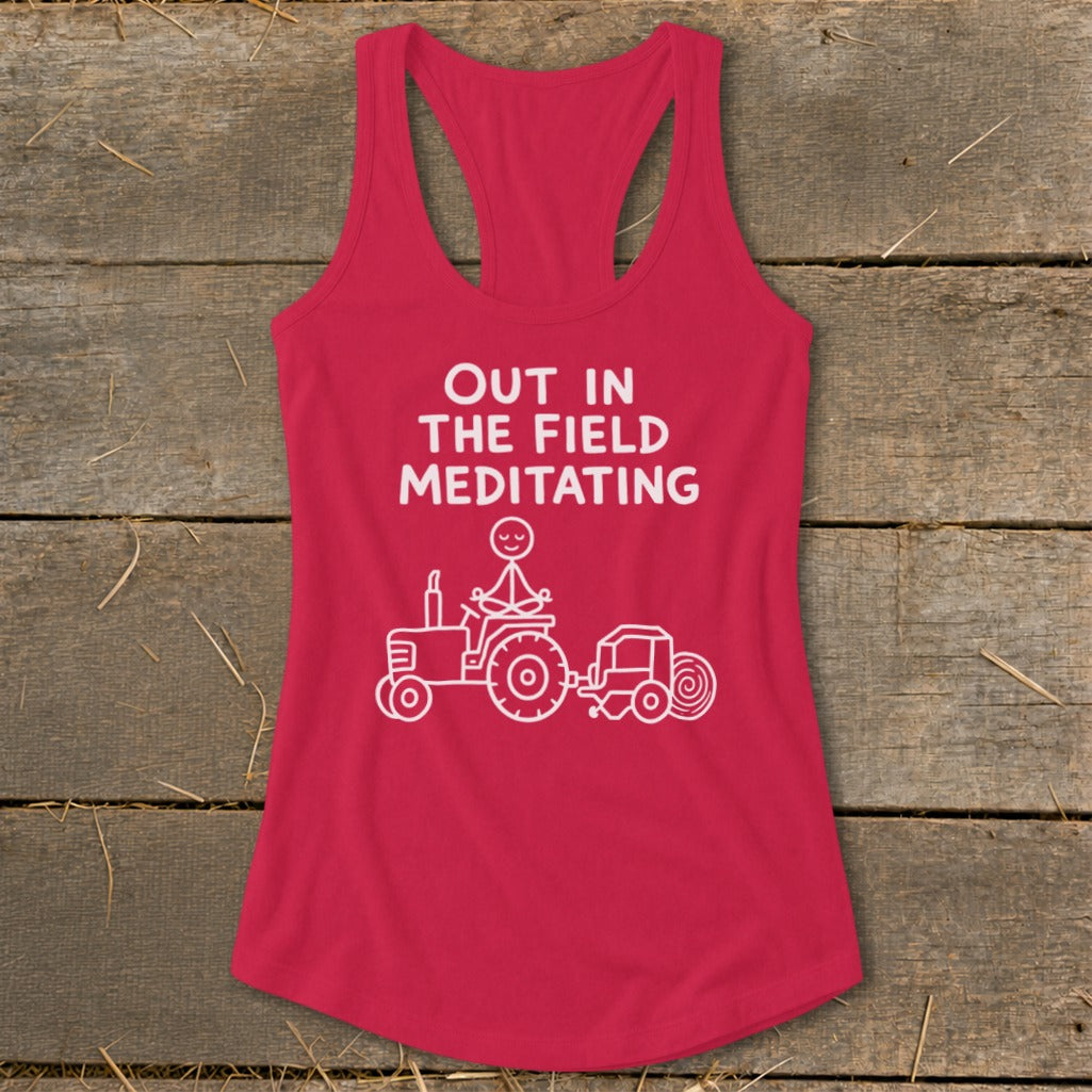 Red tank top with "Out in the Field Meditating" text and tractor graphic.