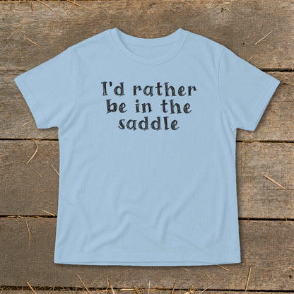 Light blue t-shirt with black text that reads "I'd rather be in the saddle".