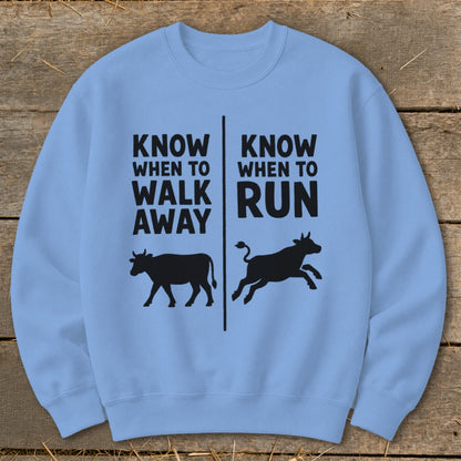 Light blue sweatshirt with "Know When to Walk Away" and "Know When to Run" text and cow illustrations.