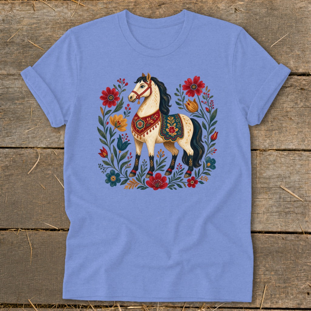 Light blue t-shirt with a cream horse surrounded by colorful folk-art flowers.
