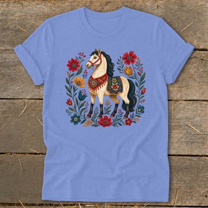 Light blue t-shirt with a cream horse surrounded by colorful folk-art flowers.