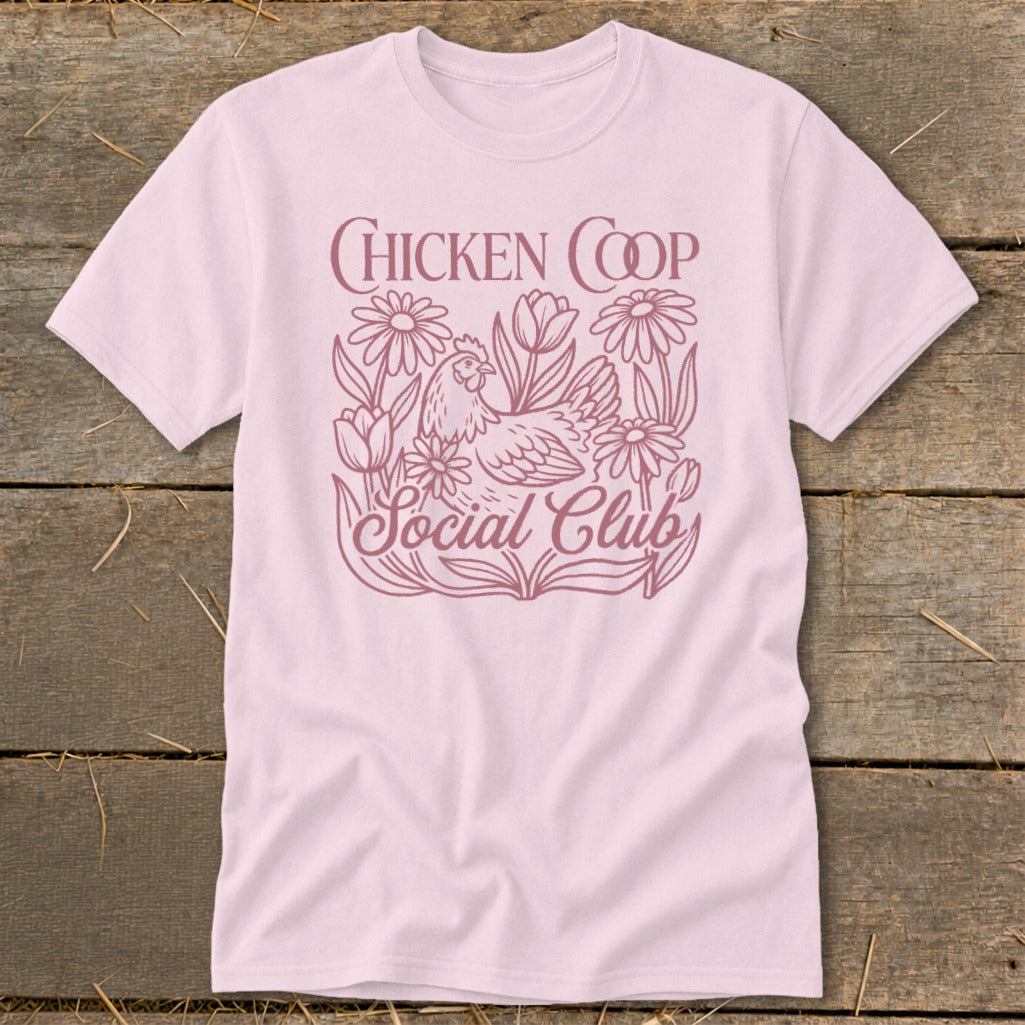 Pink t-shirt with "Chicken Coop Social Club" text and a chicken surrounded by flowers.