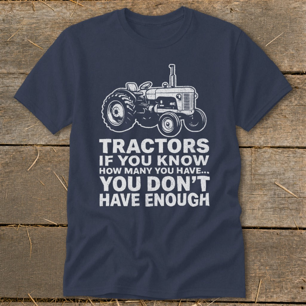 Navy t-shirt with white tractor graphic and text: "Tractors if you know how many you have... you don't have enough".