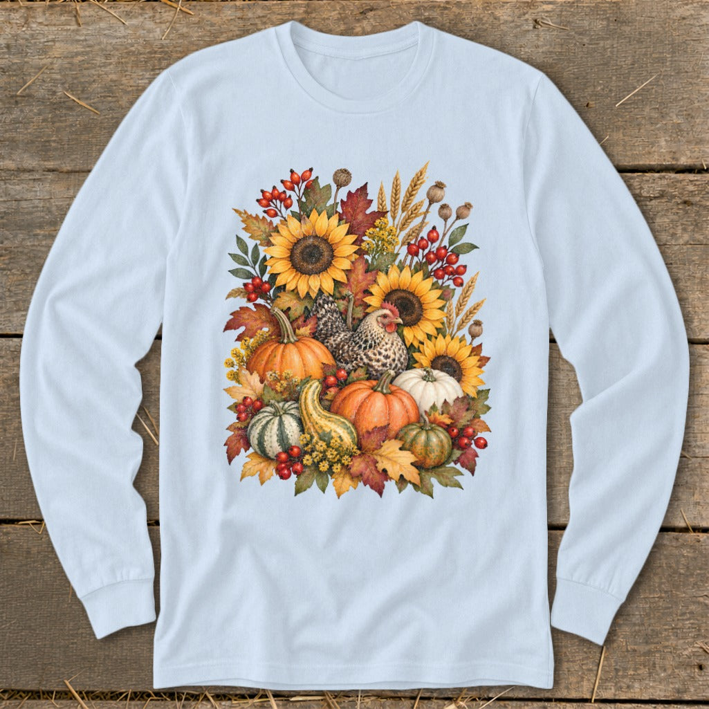 Light blue long-sleeve shirt with a fall harvest graphic of sunflowers, pumpkins, gourds, and a chicken.