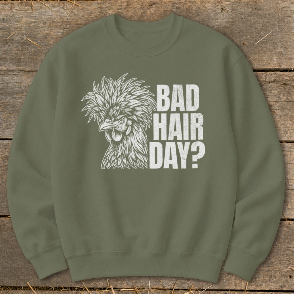 Green sweatshirt with a white graphic of a crested chicken and text reading "BAD HAIR DAY?".