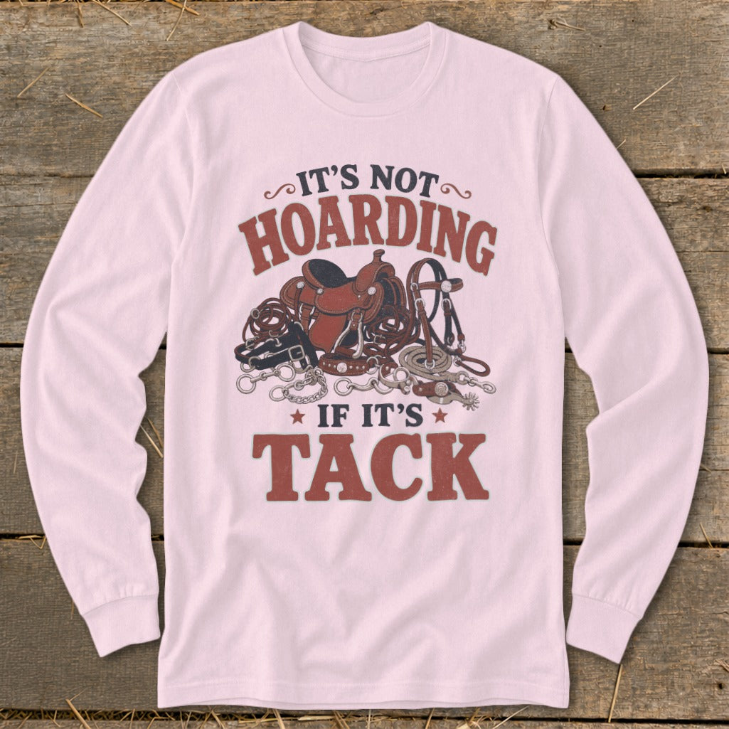 Pink long sleeve shirt with "It's Not Hoarding If It's Tack" and horse tack illustration.