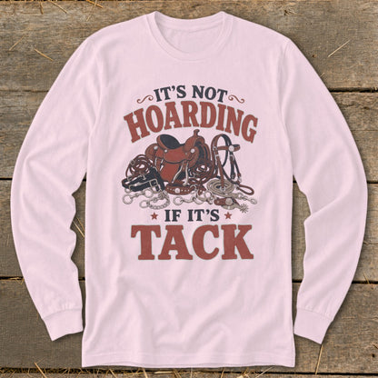 Pink long sleeve shirt with "It's Not Hoarding If It's Tack" and horse tack illustration.