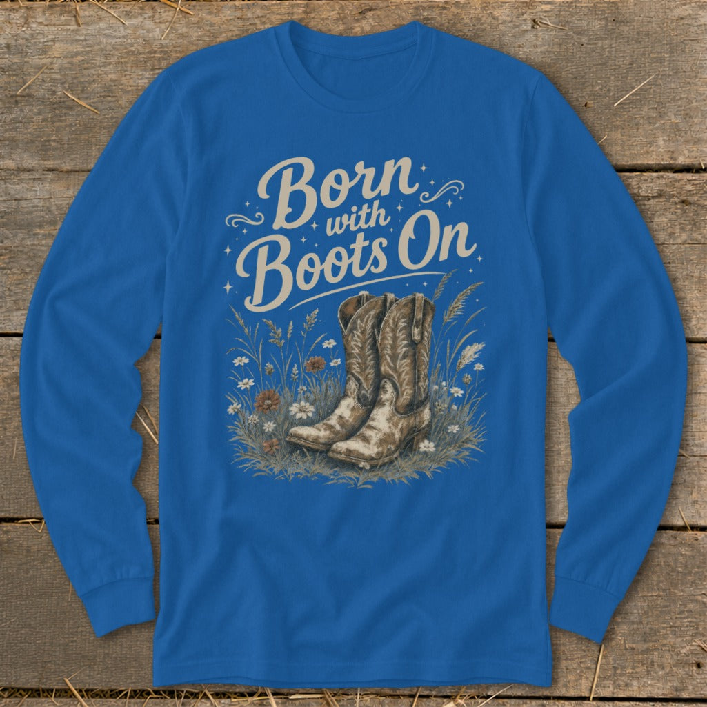Blue long-sleeve shirt with text "Born with Boots On" and cowboy boots illustration.