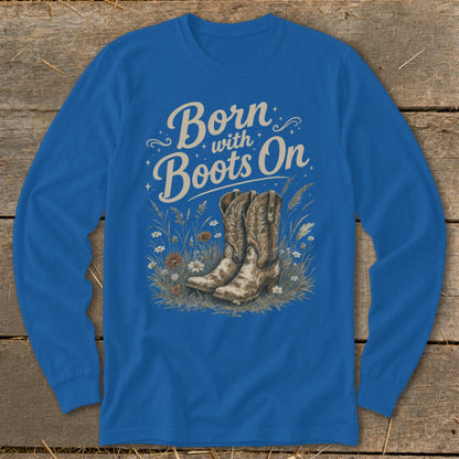 Blue long-sleeve shirt with text "Born with Boots On" and cowboy boots illustration.