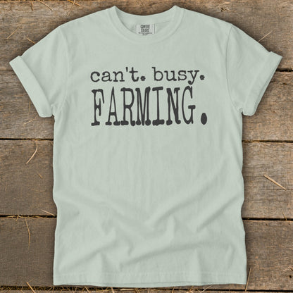 Light green t-shirt with "can't. busy. FARMING." printed in black.