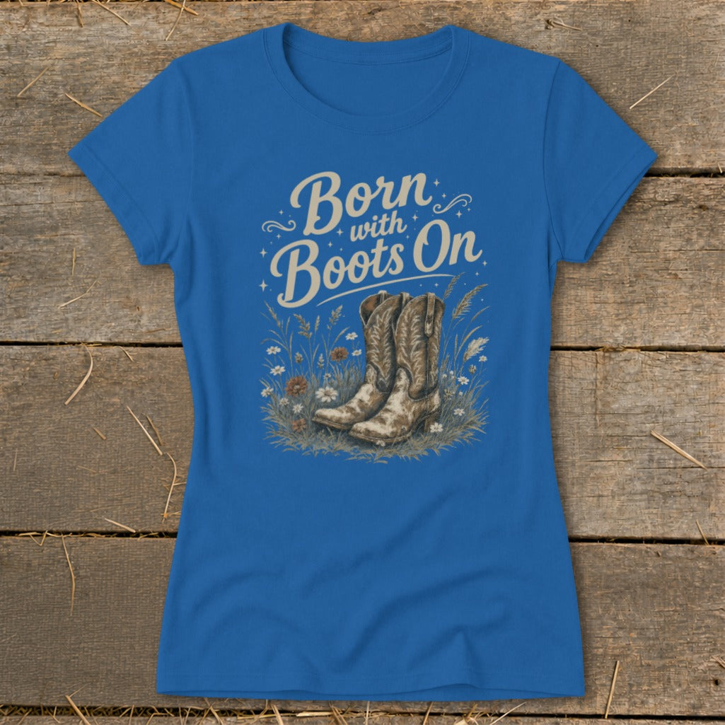 Blue t-shirt with "Born with Boots On" text and cowboy boots illustration.
